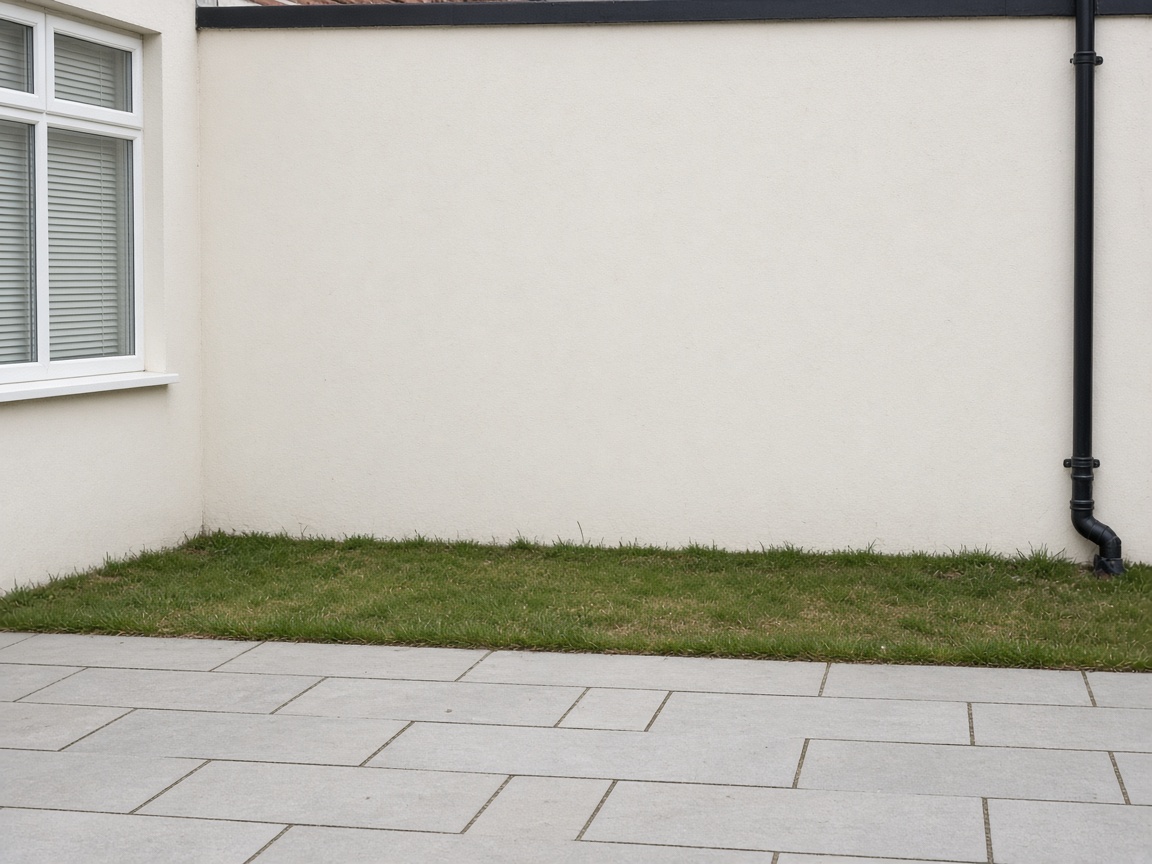 Bare garden wall before artificial hedging is fitted
